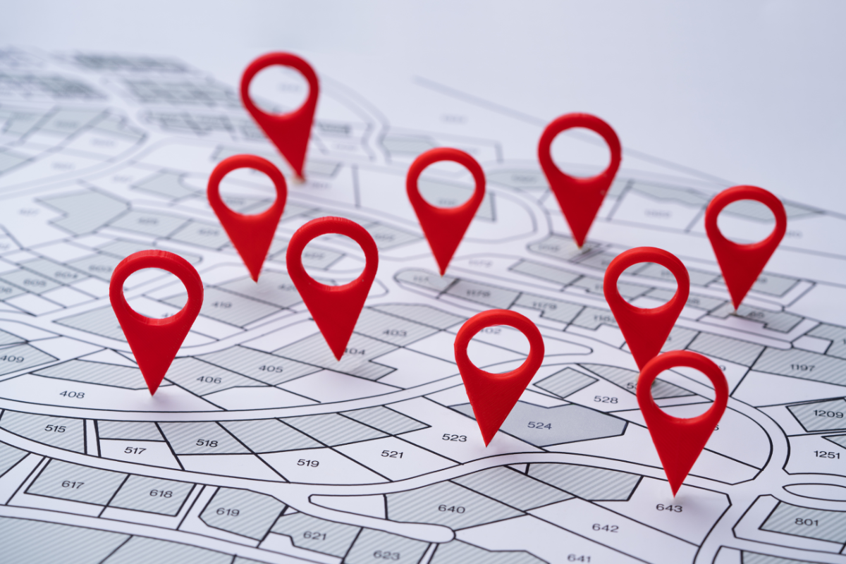 A map with a bunch of red pins on it