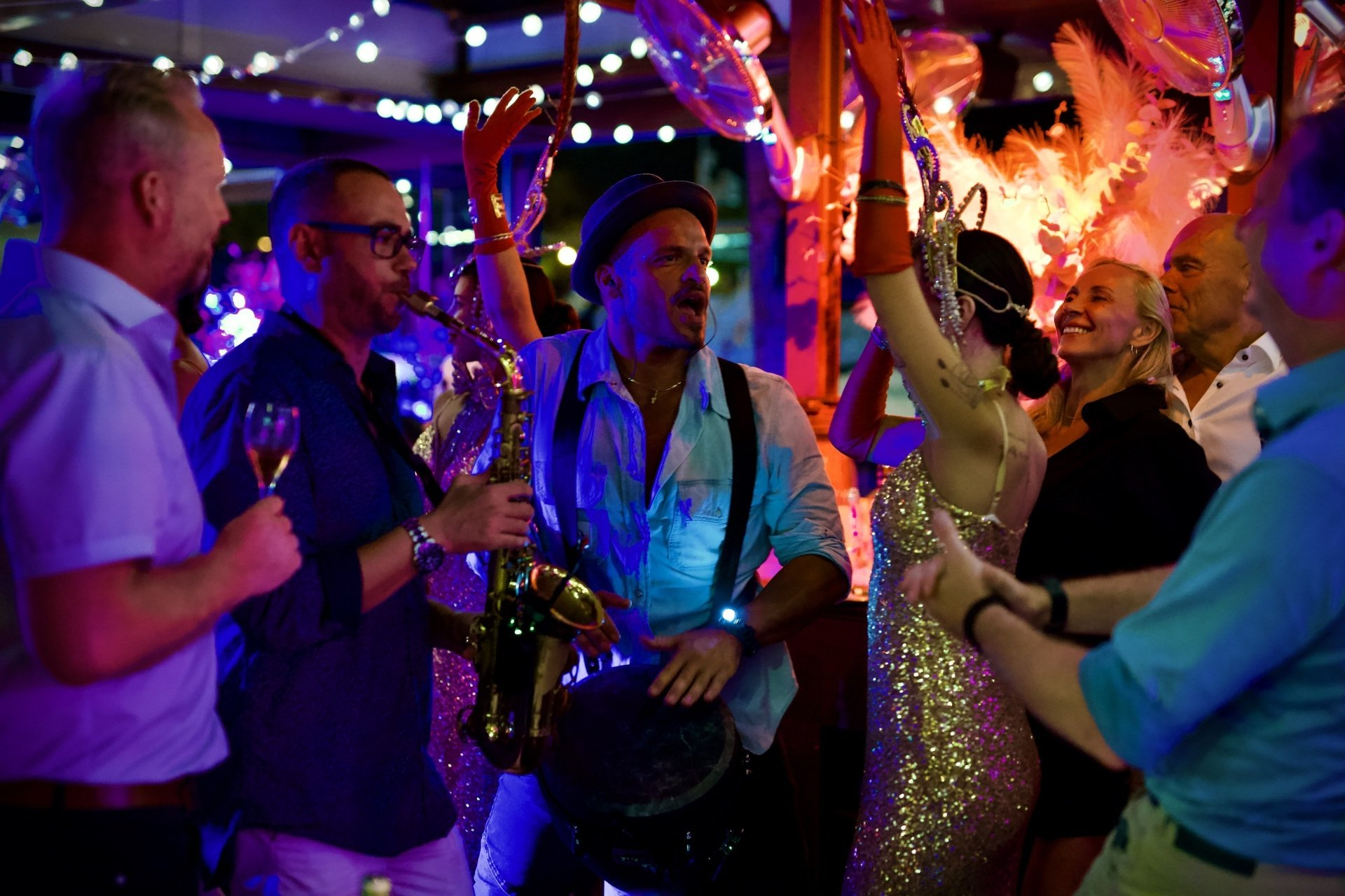 A man playing a saxophone at a party