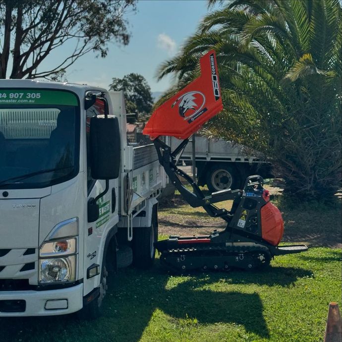 small dumper dropping load on truck