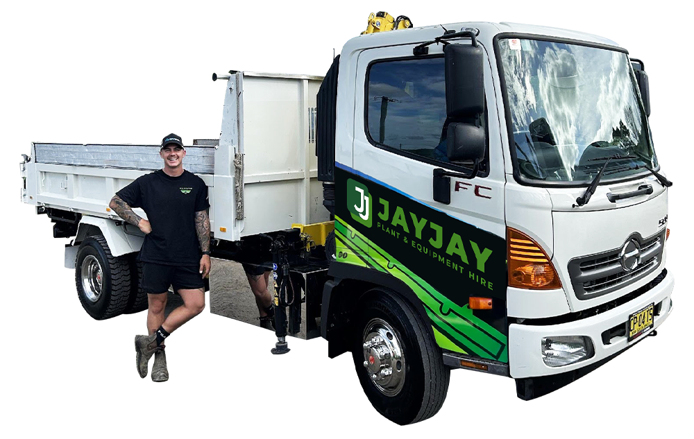Truck with a man standing beside it