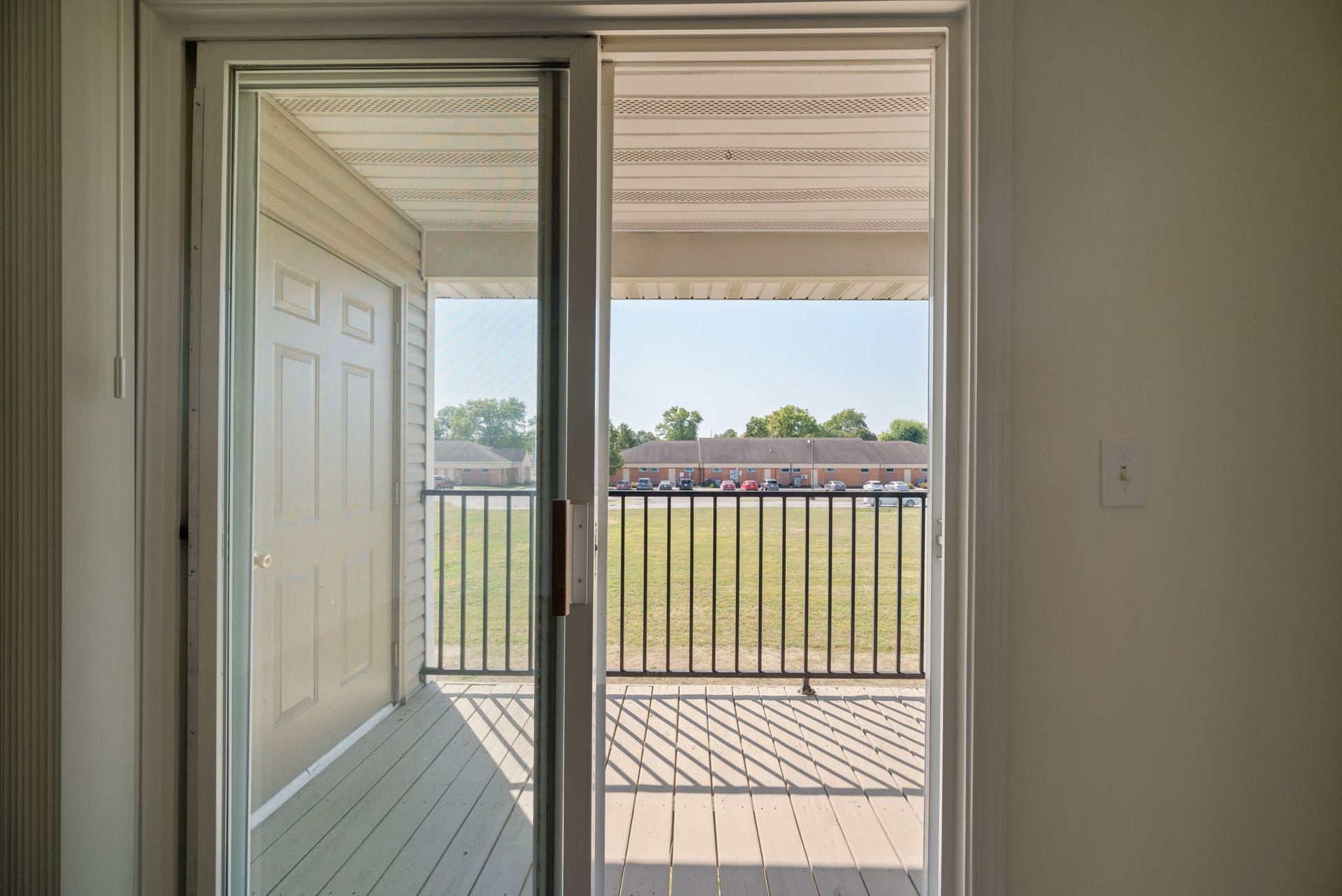 Sliding glass door leading to a balcony.
