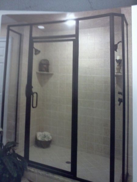A picture of a shower with a black frame