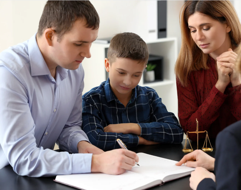 Family, including child, consults with a lawyer, reviewing documents. Scales of justice are visible.