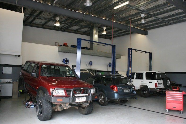 A Row Of Cars Are Parked Inside Of A Garage — Browns Autobahn In Nambour, QLD