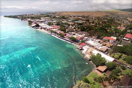 An aerial view of a small town next to the ocean