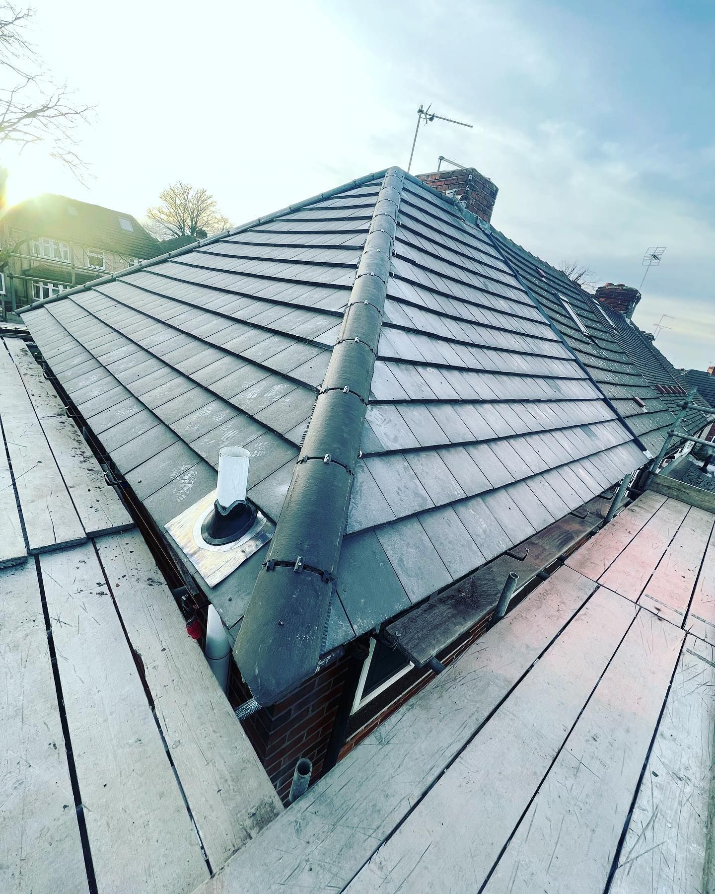 a picture of a roof replacement in grey concrete tile by Hightop roofers Rotherham