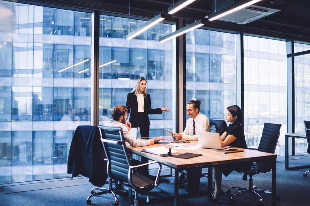 Business Team Meeting in Modern Office — INtelephony In Albury, NSW
