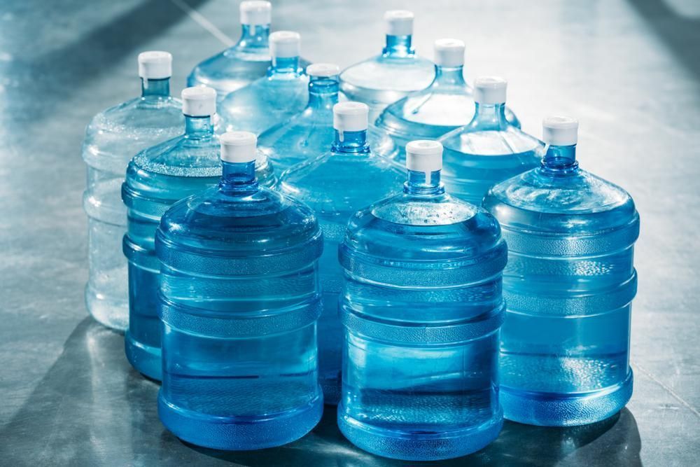 A High-angle View of Multiple Blue Plastic Water Jugs Arranged in a Cluster — Cool Blue Ice & Water in Parkes, NSW