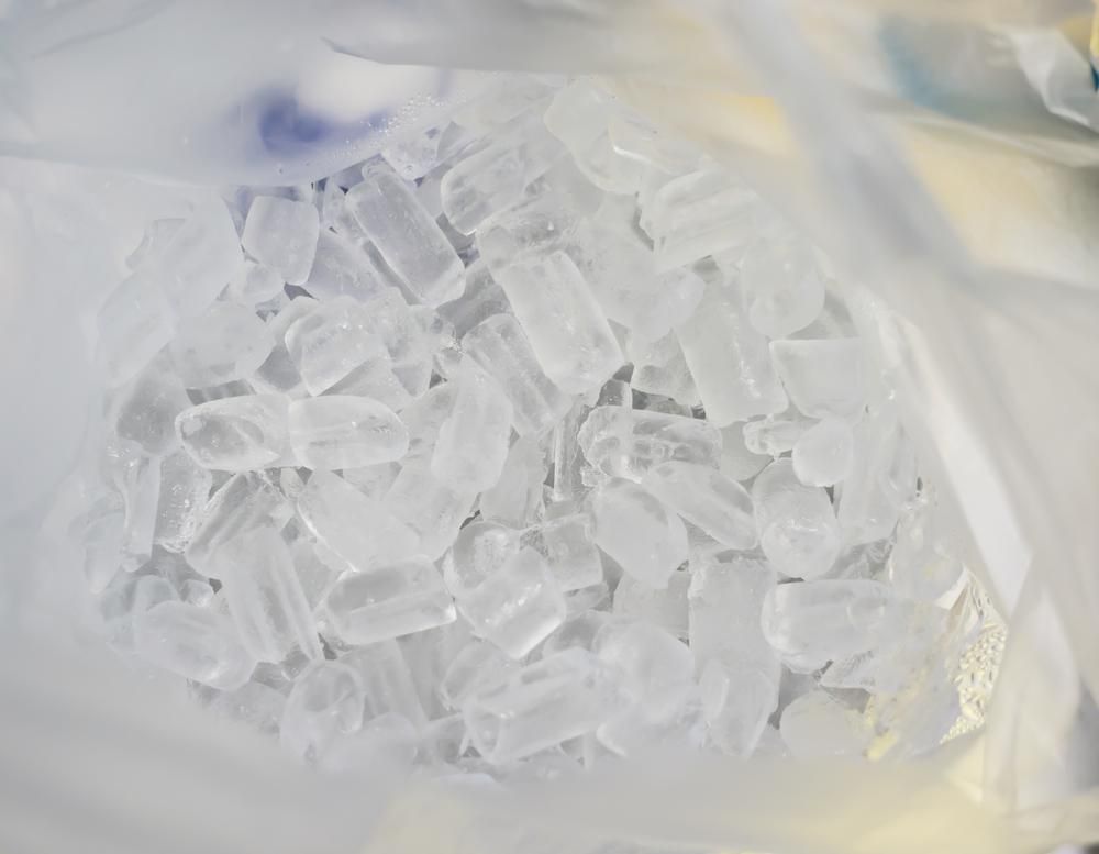 A Pile of Clear, Hole-centered Ice Cubes Inside a Partially Visible Plastic Bag — Cool Blue Ice & Water in Hunter Valley, NSW