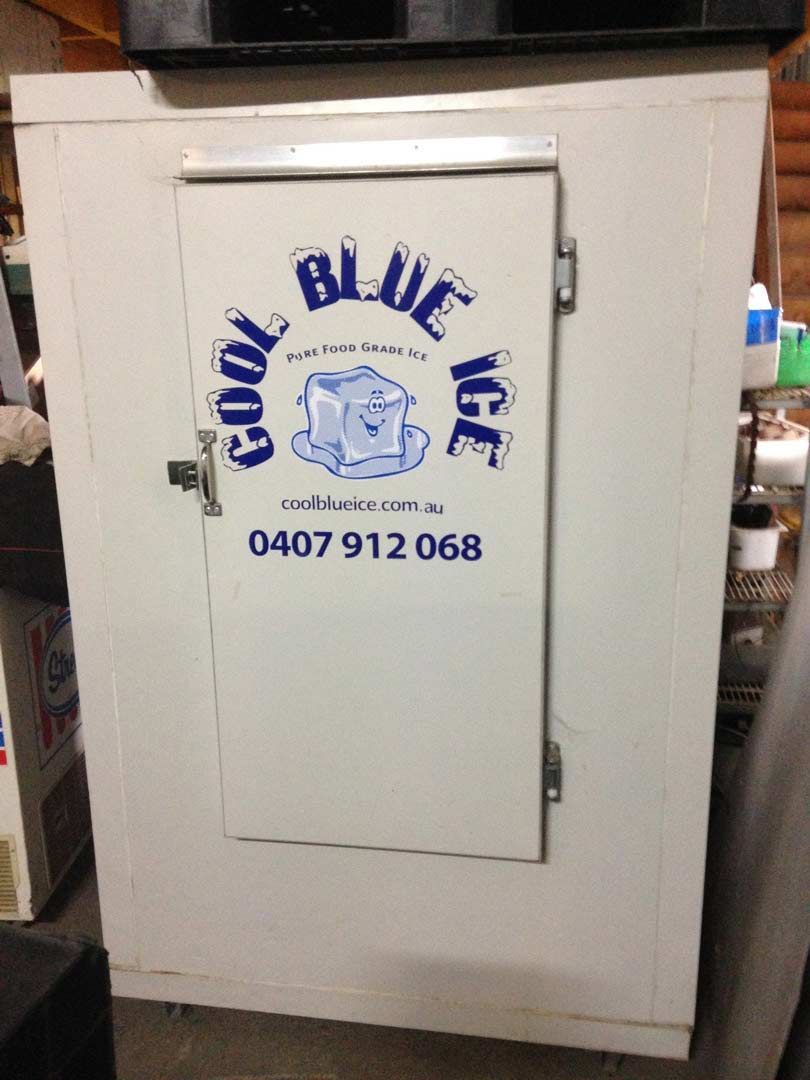 A White Ice Storage Freezer Featuring the Cool Blue Ice Logo Truck Commercial — Cool Blue Ice & Water in Taminda, NSW