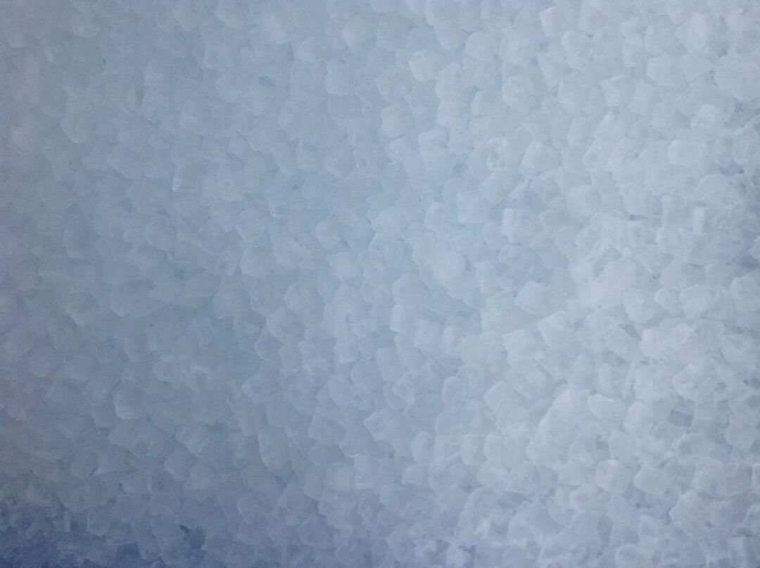 A Close-up View of Small, Translucent, Pale Blue Crystalline Grains — Cool Blue Ice & Water in Taminda, NSW