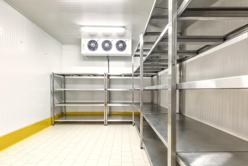 A Walk-in Commercial Refrigerator With Metal Shelving Units — Cool Blue Ice & Water in Taminda, NSW