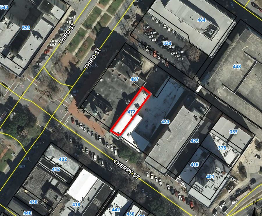 An aerial view of a city showing the location of a building