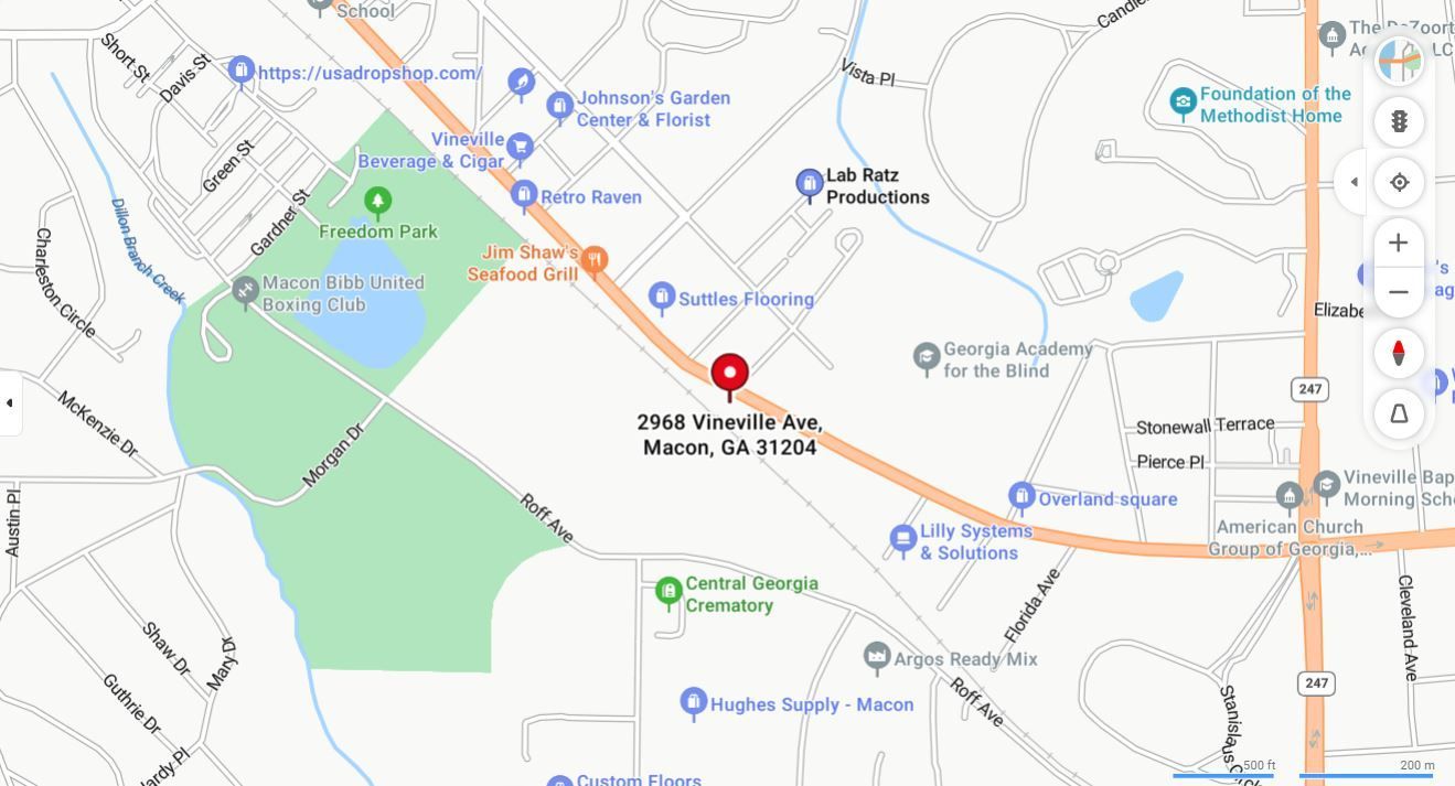 Map showing a pinned location near roads and green park area, with nearby place labels.
