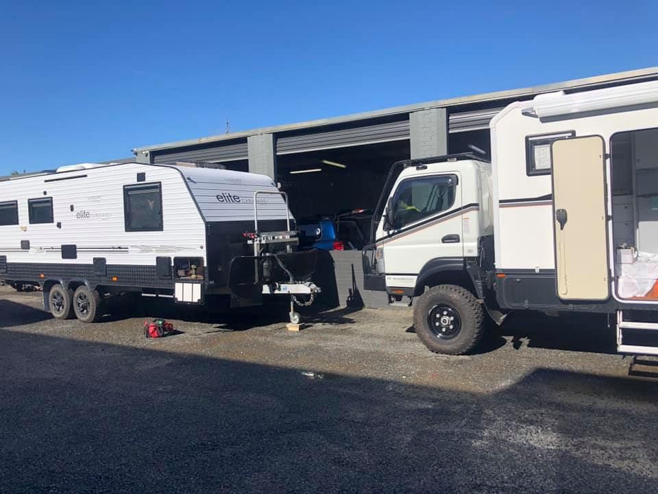 A White Caravan Connected to a Truck — Gibbo's Auto Electrics & Air Conditioning Services in Lake Macquarie, NSW