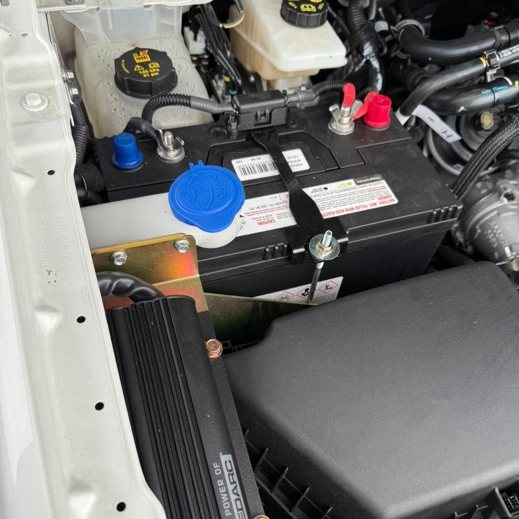 Car Engine Bay Showing Battery — Gibbo's Auto Electrics & Air Conditioning Services in Belmont, NSW