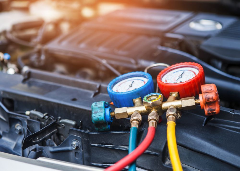 A Car Engine Bay With Air Conditioning Gauges — Gibbo's Auto Electrics & Air Conditioning Services in Lake Macquarie, NSW