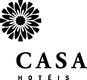 Logotipo da CASA Hotels com emblema floral preto e texto sobre fundo branco.