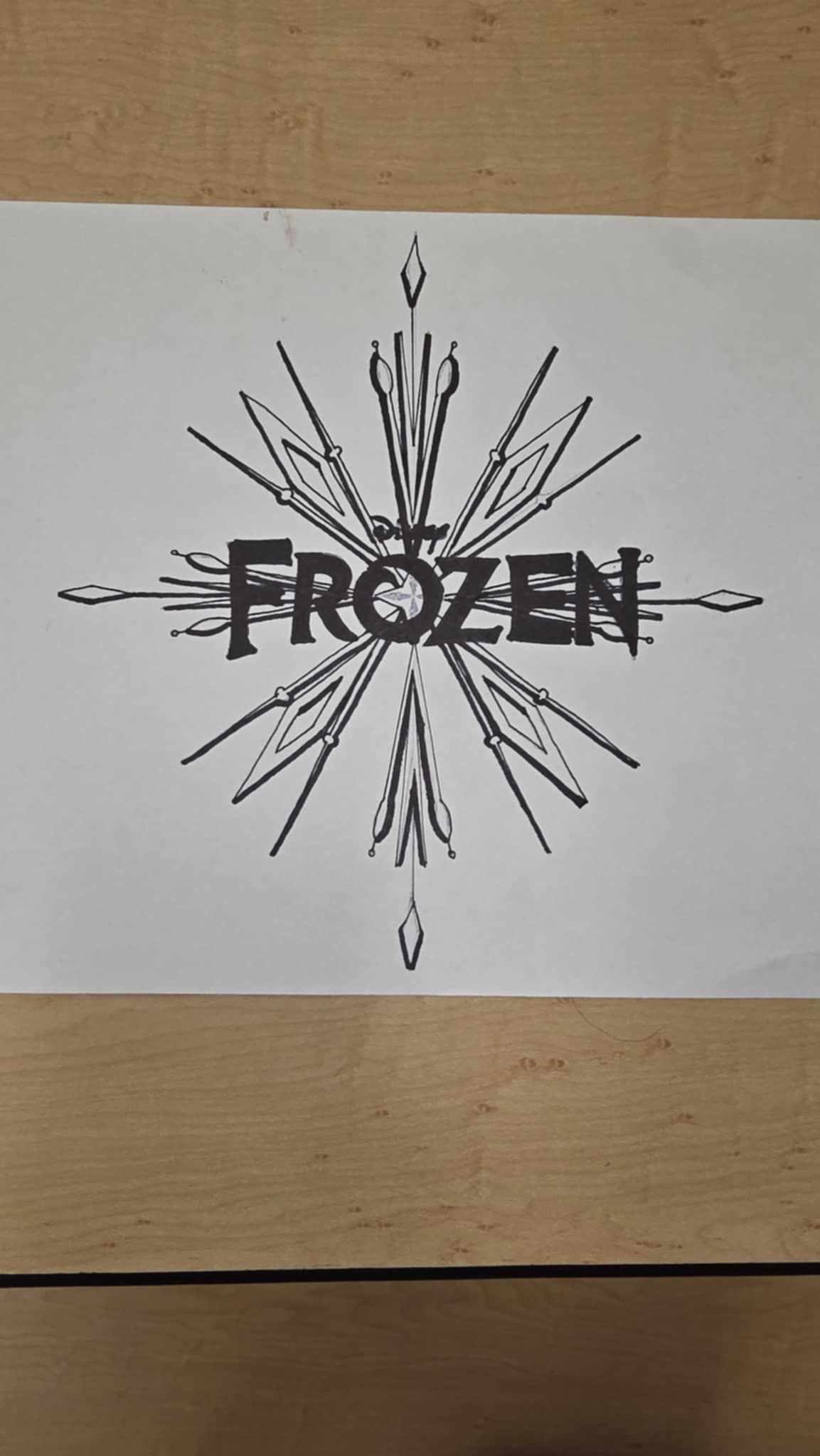 Frozen logo in stylized snowflake design. Black text: