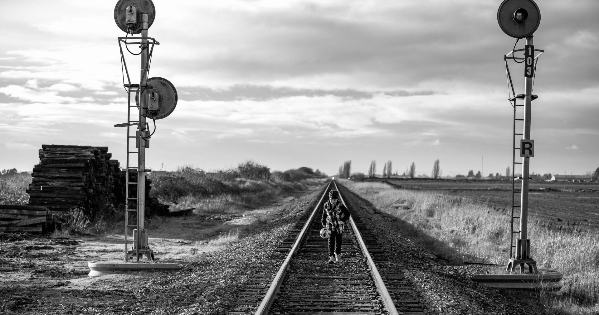 Natalie-DAngelo-Photography-Vancouver-BC-Canada-BlackWhite-Family-Portraits-Visual-Storyteller-boy-walking-traintracks