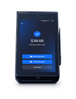 A cell phone with a payment approved on the screen.