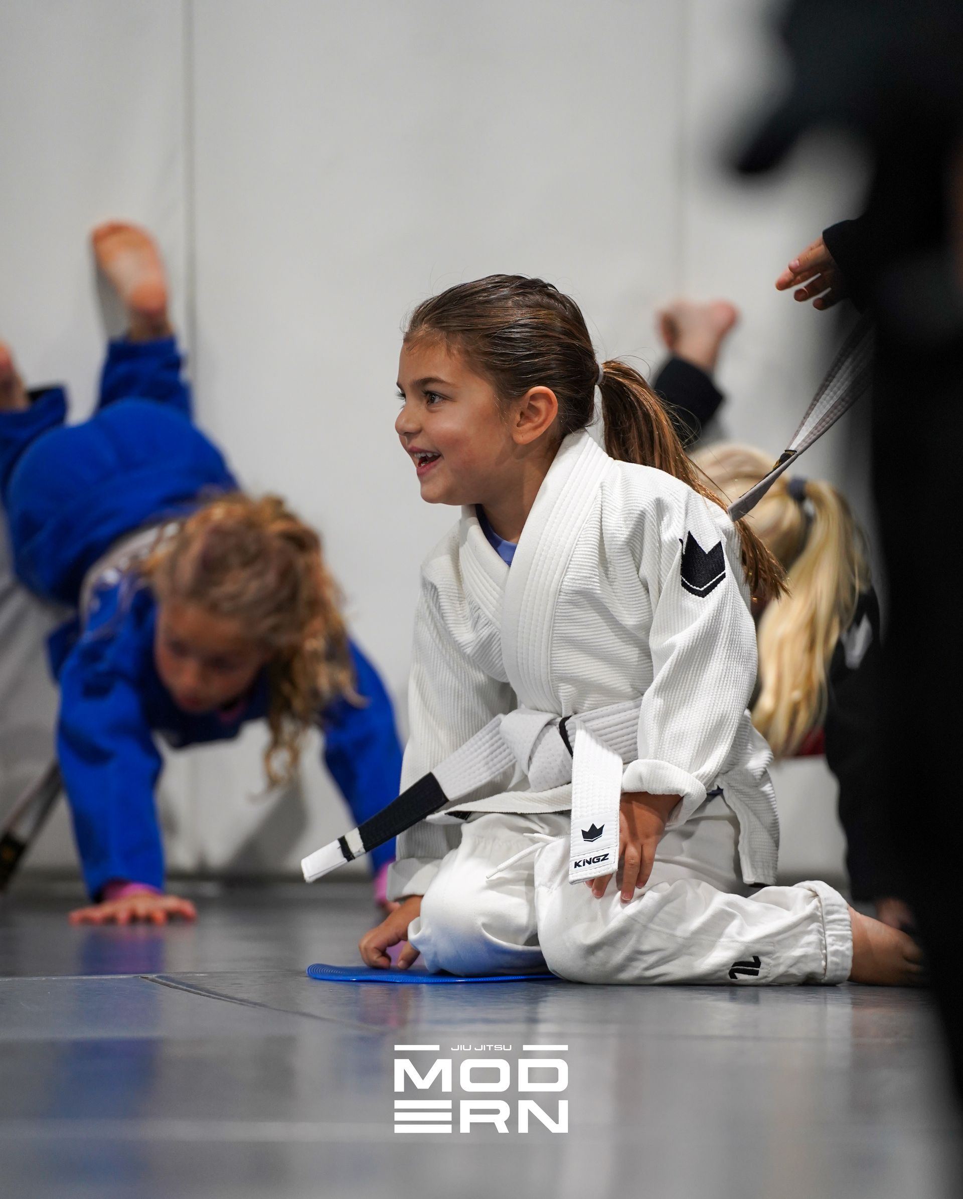 Kids practicing controlled grappling at Jiu-Jitsu Modern in North Babylon, NY to build calm focus and confidence.