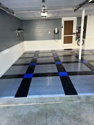 A garage with a blue and black checkered floor.