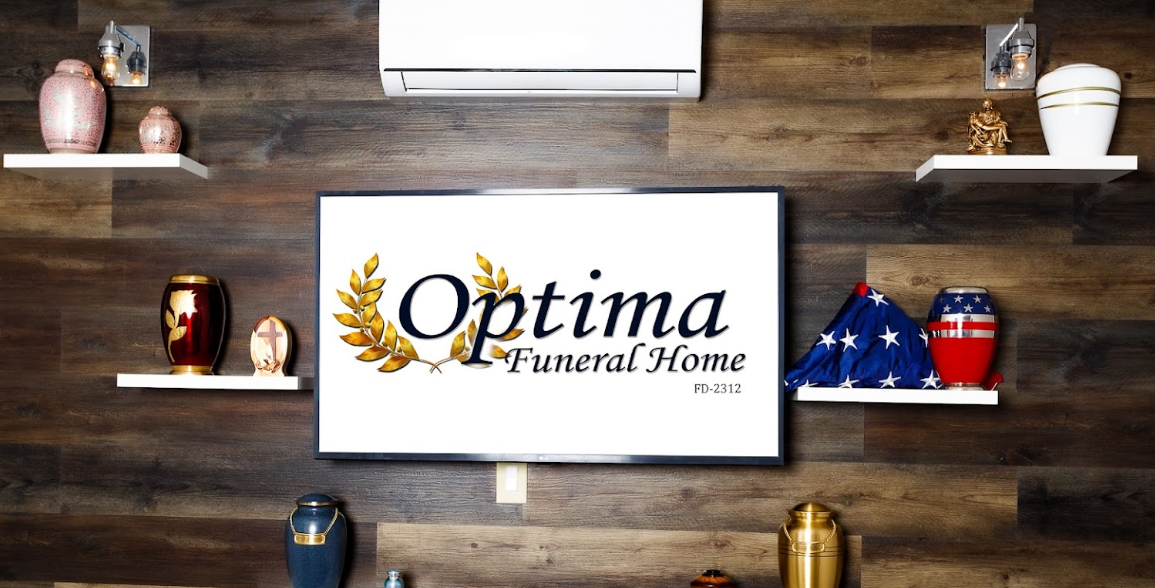 A white coffin with blue and white flowers on it