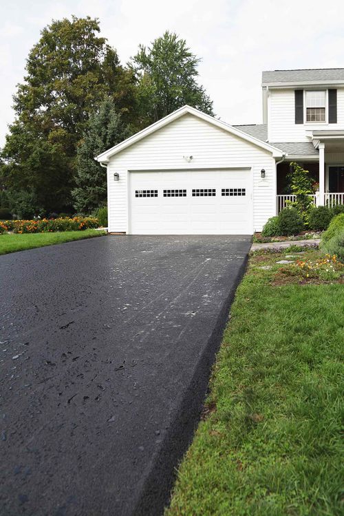White house with nice driveway White house with nice driveway