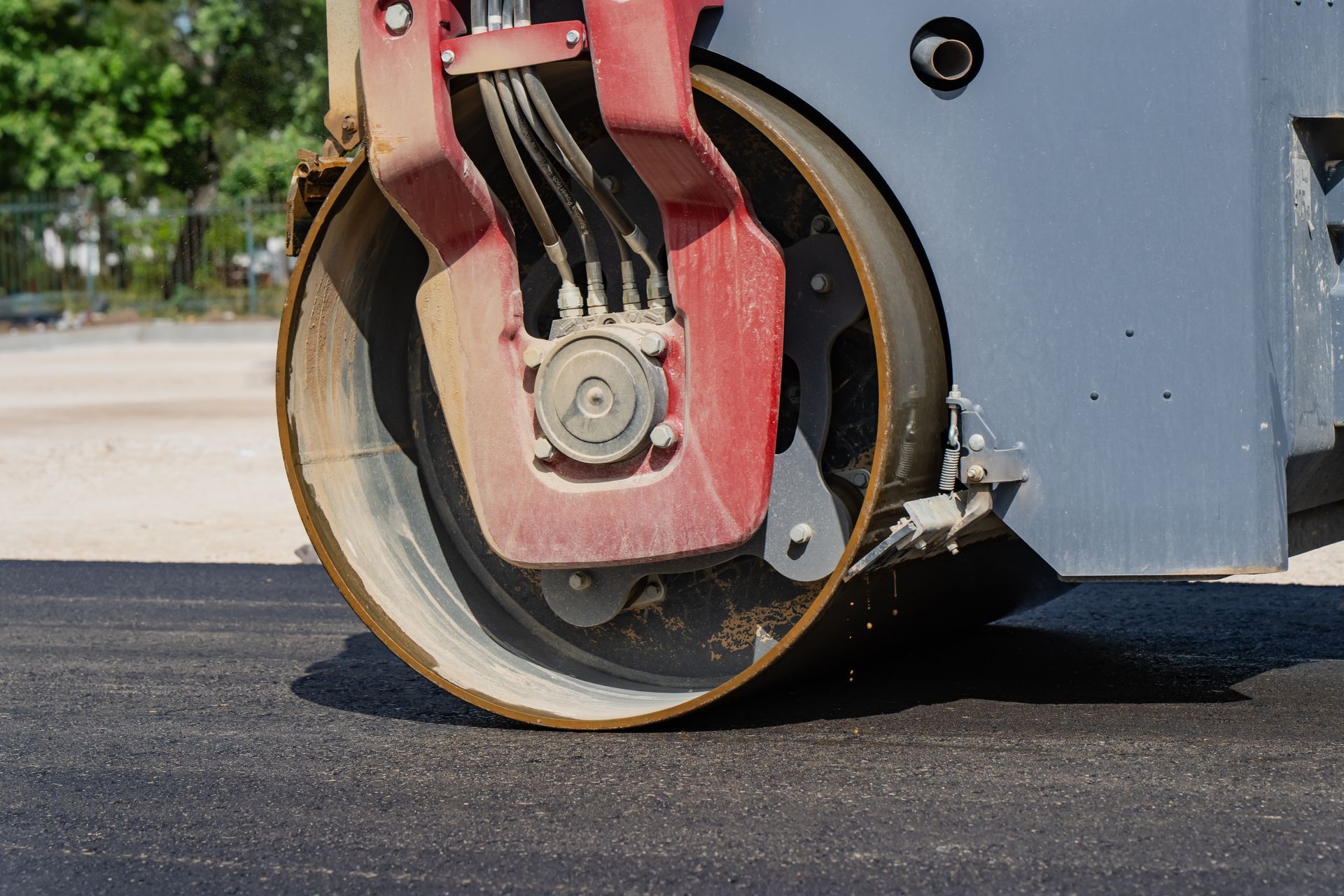 Asphalt roller compacting fresh pavement Asphalt roller compacting fresh pavement