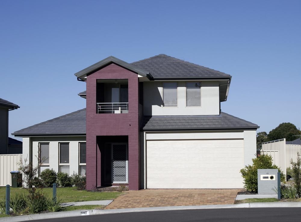 A Purple And White House With A White Garage Door — The Roller Door Man NQ In Portsmith, QLD