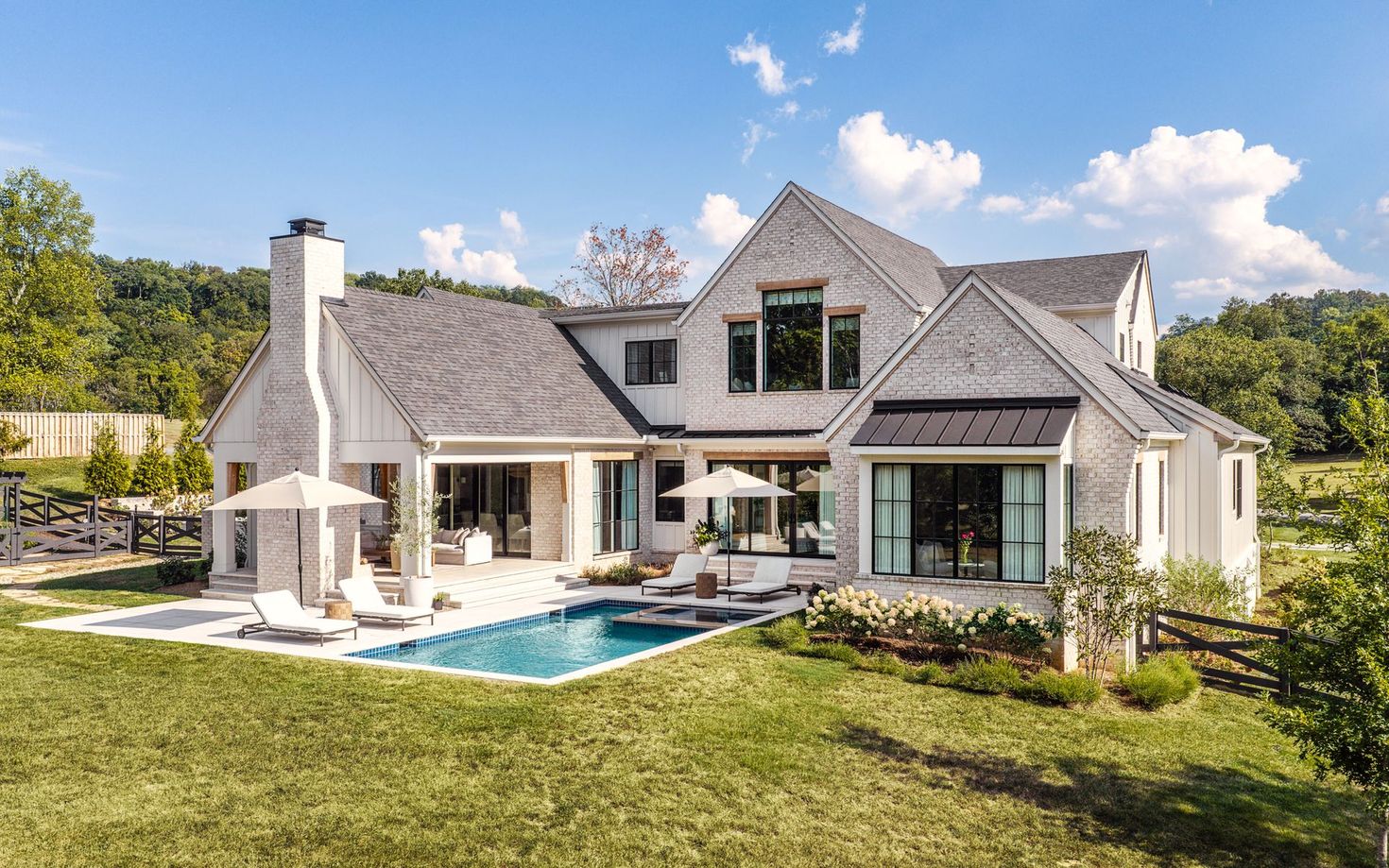 Forest Hills Riverview Nashville Farmhouse exterior with pool by Origin Architecture