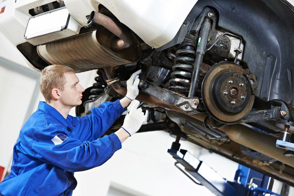 A Repairman Worker In Car — Tyre Service in Blackall Tambo, QLD