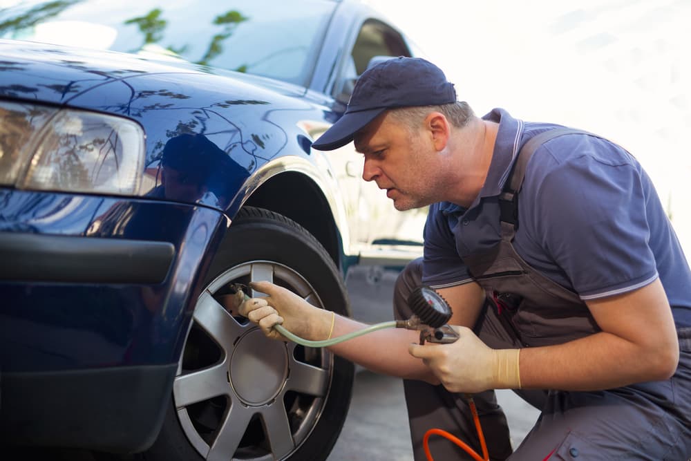 Mechanic Repairman Making Tyre — Tyre Service in Emerald, QLD