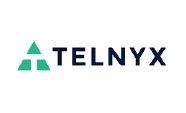A telnyx logo with a green triangle on a white background.