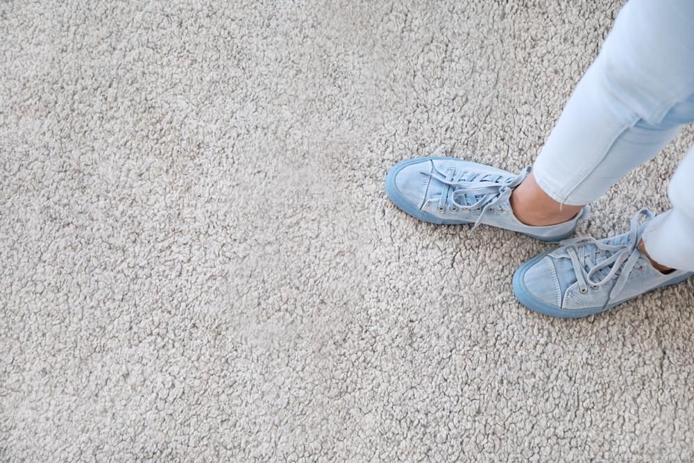 A Person Wearing Blue Sneakers Is Standing On A Carpet —  Cabonne Carpets In Molong, NSW