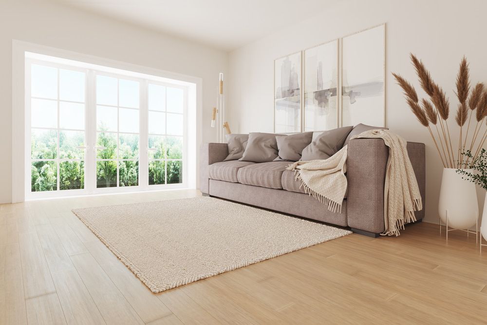 A Living Room With A Couch , Rug , And Large Windows —  Cabonne Carpets In Molong, NSW