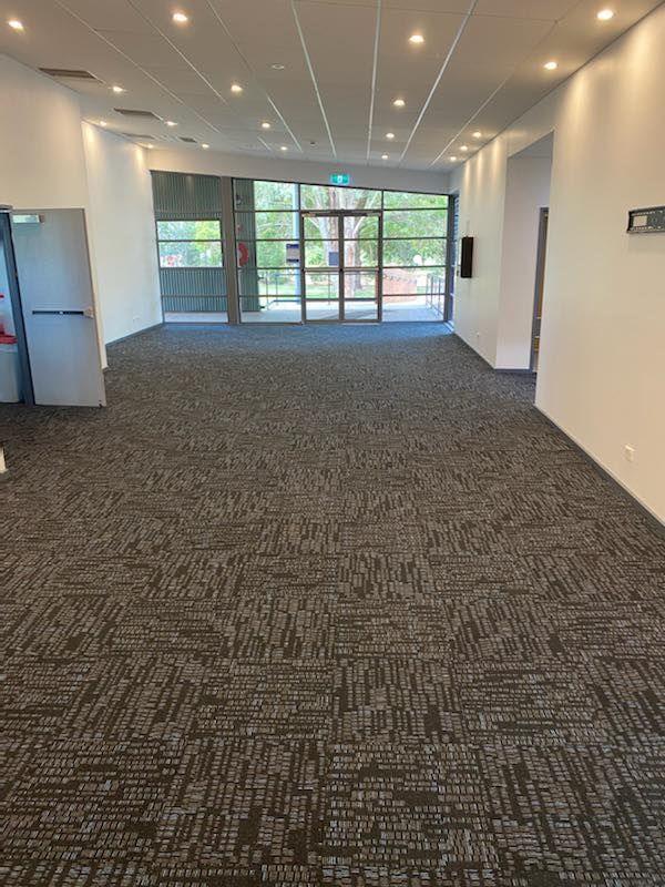 A Large Empty Room With A Black Carpet And White Walls —  Cabonne Carpets In Molong, NSW