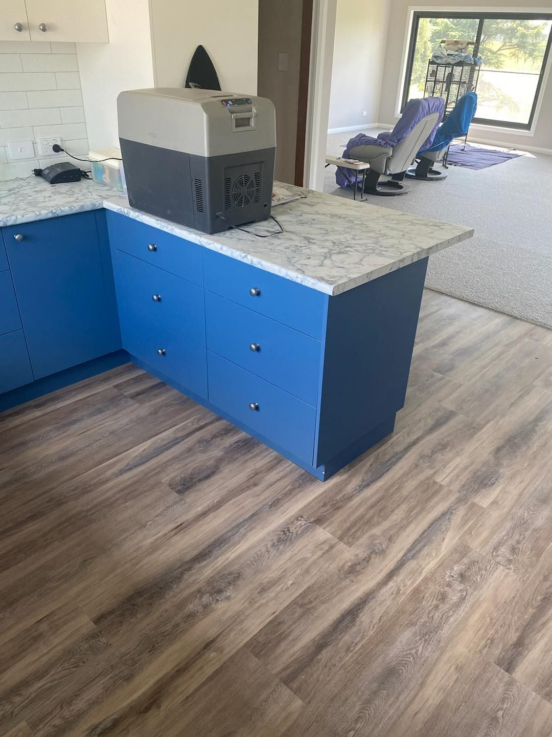 A Cooler Is Sitting On Top Of A Counter In A Kitchen —  Cabonne Carpets In Molong, NSW
