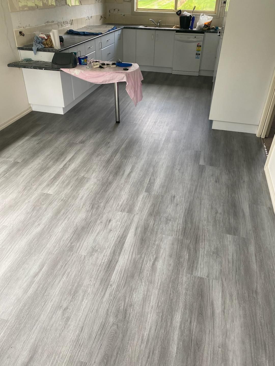 A Kitchen With A Table And A Gray Floor —  Cabonne Carpets In Molong, NSW
