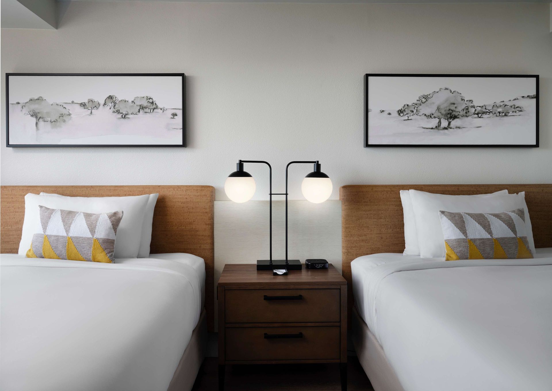 A hotel room with double queen beds at the Sonesta OC Airport Irvine Hotel.