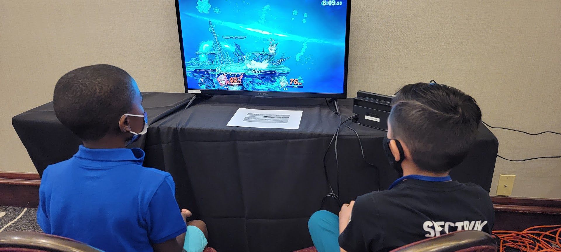 Two young boys are playing in the Super Smash Bros. tournament at GameSchoolCon in IRvine, CA.