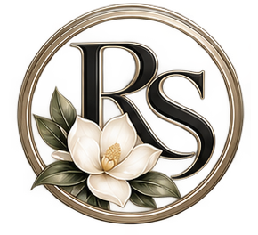 Round gold monogram logo with black “RS” and white flowers and green leaves