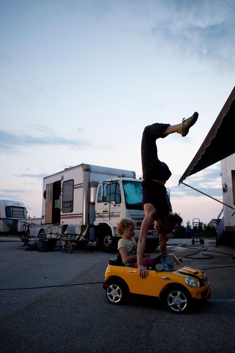 Wendy and Jacey play around while the rest of the crew works to tear down the tent and move on to the next city.
