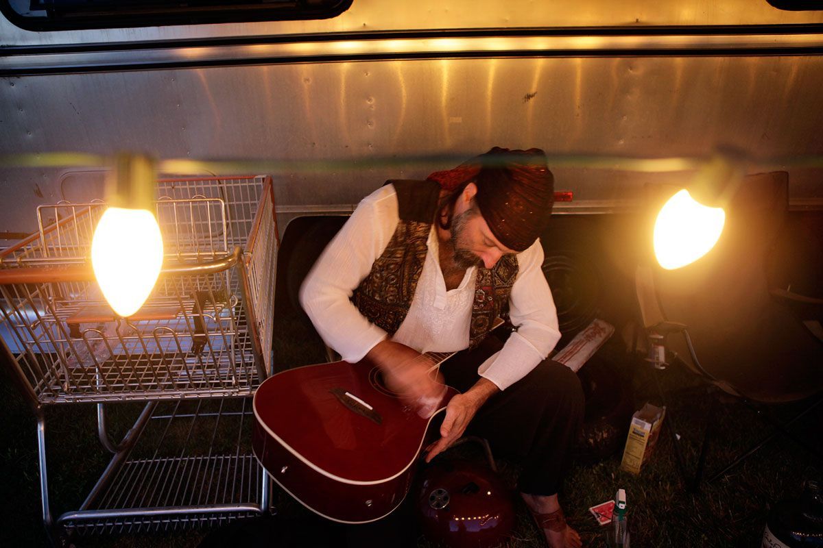 Performing without his regular guitar (it was stolen at the previous stop on the tour) this musician must make do with a secondhand guitar which needs attention after almost every show.