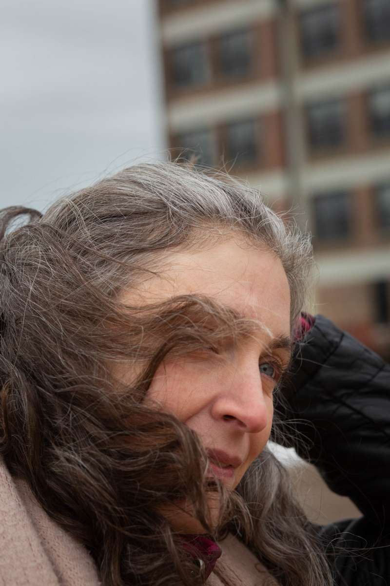 Older woman with silver hair near the lake in Chicago