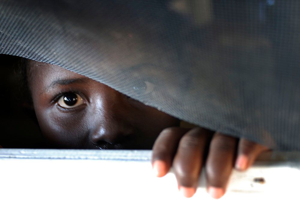 Everlyn Sesay spends another afternoon at home waiting for her life to start in America. The family has been put in a holding pattern because they are waiting for papers and documents to allow them to work and go to school.