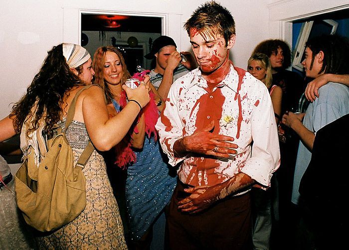 Brian Humerkowzer, in his ‘blood, trash, disaster’ themed clothes, poses with his friend Emily Heilsman at ‘Lancaster Prom,’ a street party thrown by members of the ‘hipster crowd’ at Ohio University. The prom was held as an alternative to more traditional street parties held in Athens, Ohio.