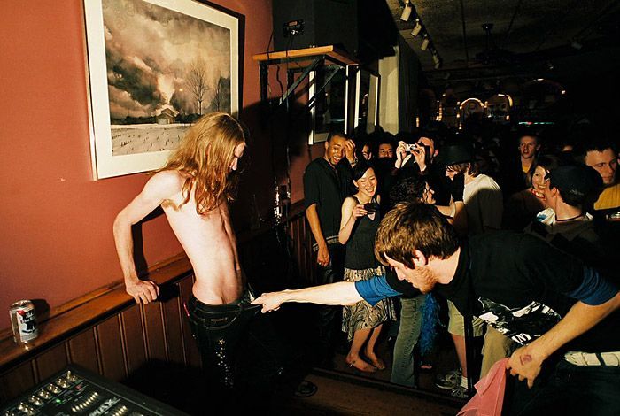Zach, left, and Jessie, right, dance at a fundraiser for the independent college radio station ACRN. 'I like to shock people, that’s my style,' says Zach. 'The more of a reaction I get, the better. Dancing sexy with another guy is just another way of getting attention.'
