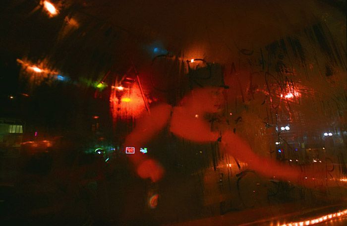 V Fox, a DJ for ACRN, writes ACRN Rocks in the condensation on the window of Casa at $2 Prom on April 30, 2004. 'I think a lot of times I'd like to pretend we're very different from other groups,' says Liz Kozup 'But that's a little pretentious and kind of naïve to think that. People are really the same all over.'